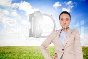 Composite image of unsmiling asian businesswoman pointing