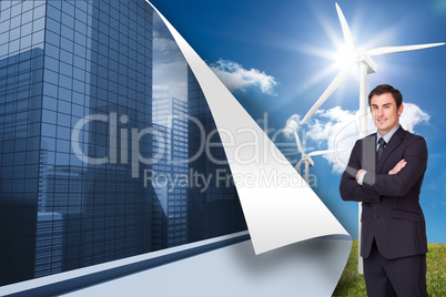 Composite image of young businessman standing cross-armed