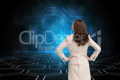 Composite image of businesswoman standing back to camera