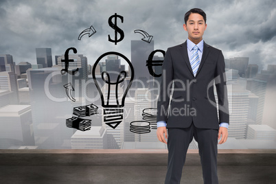 Composite image of serious asian businessman