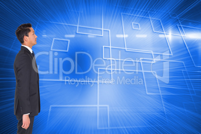 Composite image of unsmiling businessman looking away