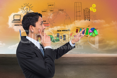 Composite image of thoughtful asian businessman pointing