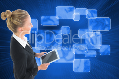 Composite image of businesswoman holding new tablet