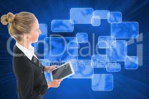 Composite image of businesswoman holding new tablet