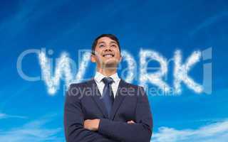 Composite image of smiling asian businessman with arms crossed