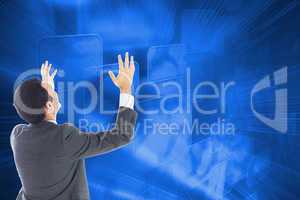 Composite image of businessman with arms raised