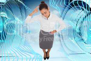 Composite image of focused businesswoman