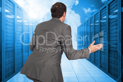 Composite image of businessman posing with hands out