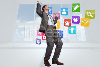 Composite image of businessman posing with hands up