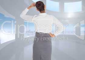 Composite image of businesswoman scratching her head