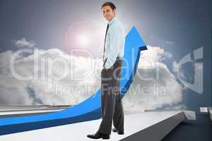 Composite image of smiling businessman standing with hands in po