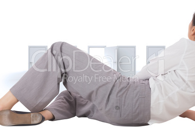 Composite image of relaxed businesswoman lying