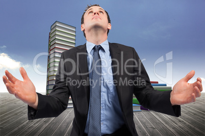 Composite image of businessman posing with arms out