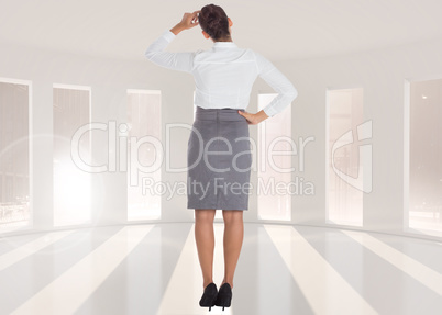 Composite image of businesswoman scratching her head