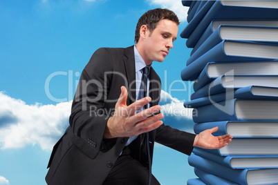 Composite image of businessman posing with arms out