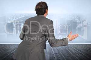 Composite image of businessman posing with hands out