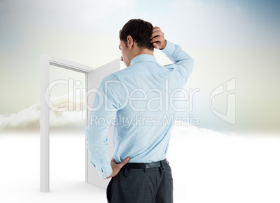 Composite image of thinking businessman with hand on head