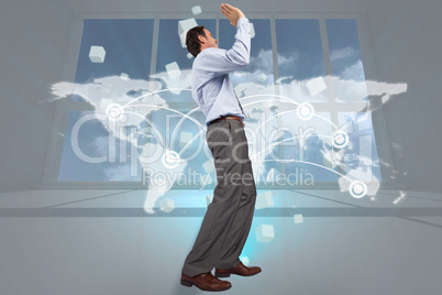 Composite image of businessman posing with hands up