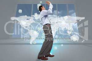 Composite image of businessman posing with hands up