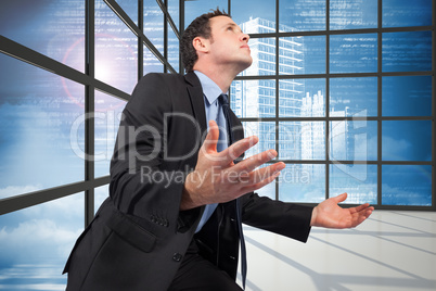 Composite image of businessman posing with arms out