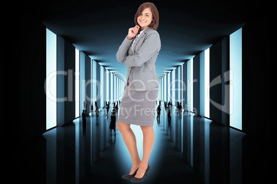 Composite image of smiling thoughtful businesswoman