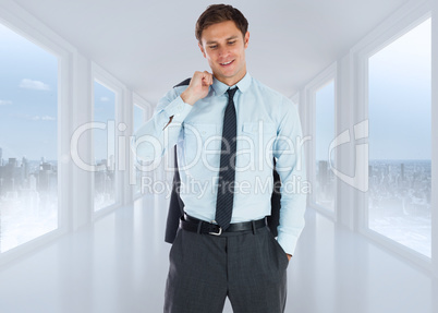 Composite image of smiling businessman holding his jacket