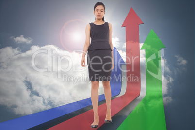 Composite image of asian businesswoman walking