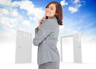 Composite image of smiling thoughtful businesswoman