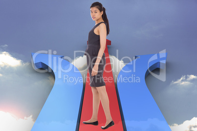 Composite image of asian businesswoman walking