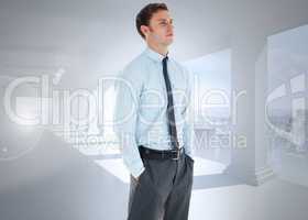 Composite image of serious businessman standing with hands in po