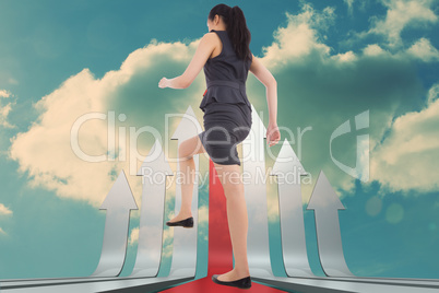 Composite image of businesswoman stepping up