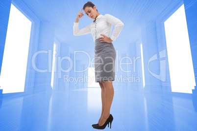 Composite image of focused businesswoman