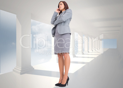 Composite image of worried businesswoman