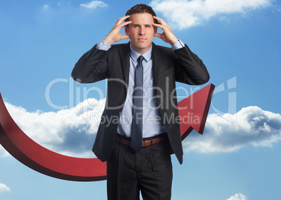 Composite image of stressed businessman with hands on head