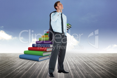 Composite image of smiling businessman holding his jacket