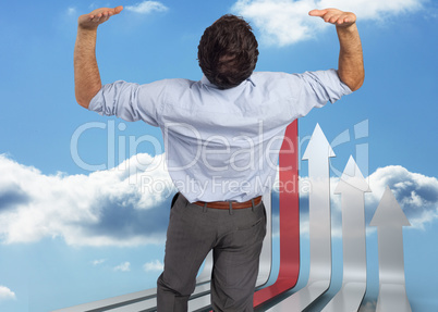 Composite image of businessman standing with hands up