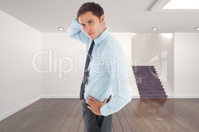 Composite image of thinking businessman scratching head