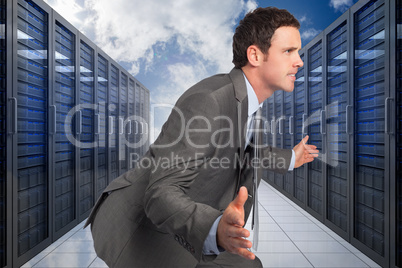 Composite image of businessman posing with hands out