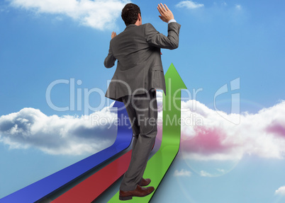 Composite image of businessman posing with hands up