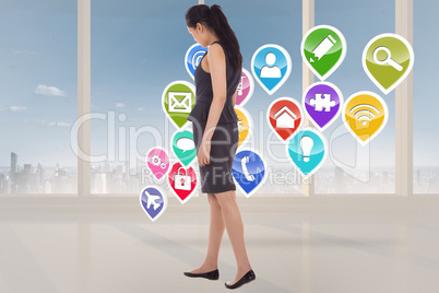 Composite image of asian businesswoman walking