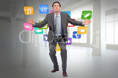 Composite image of businessman standing with arms out