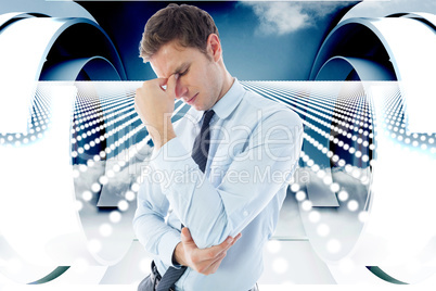 Composite image of businessman with a headache