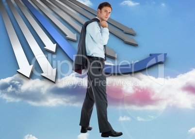 Composite image of serious businessman holding his jacket