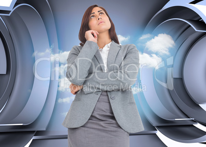 Composite image of focused businesswoman