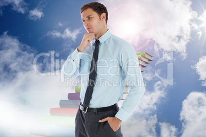 Composite image of thoughtful businessman with hand on chin