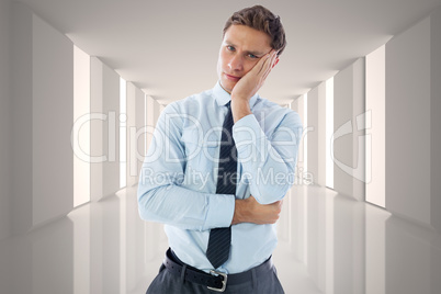 Composite image of upset thinking businessman