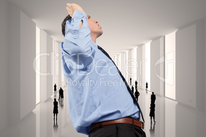 Composite image of businessman posing with arms raised