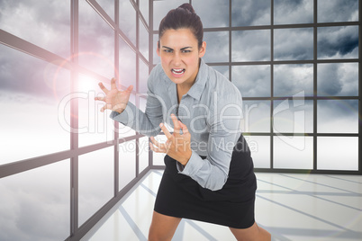 Composite image of furious businesswoman gesturing