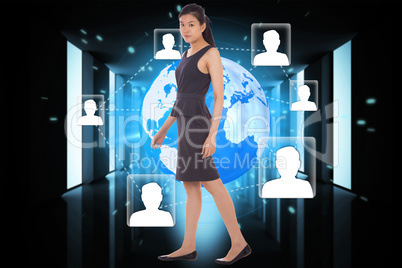 Composite image of asian businesswoman walking