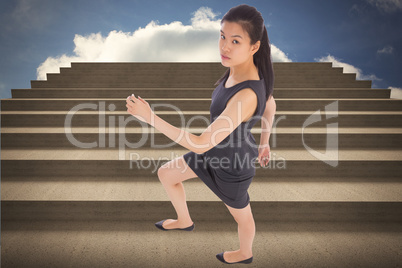 Composite image of businesswoman stepping up